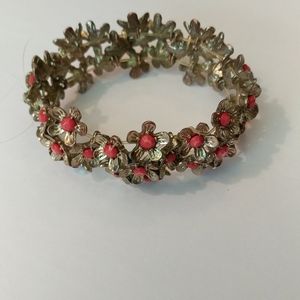 Woman's stretch, metal, gold/red flower bracelet
